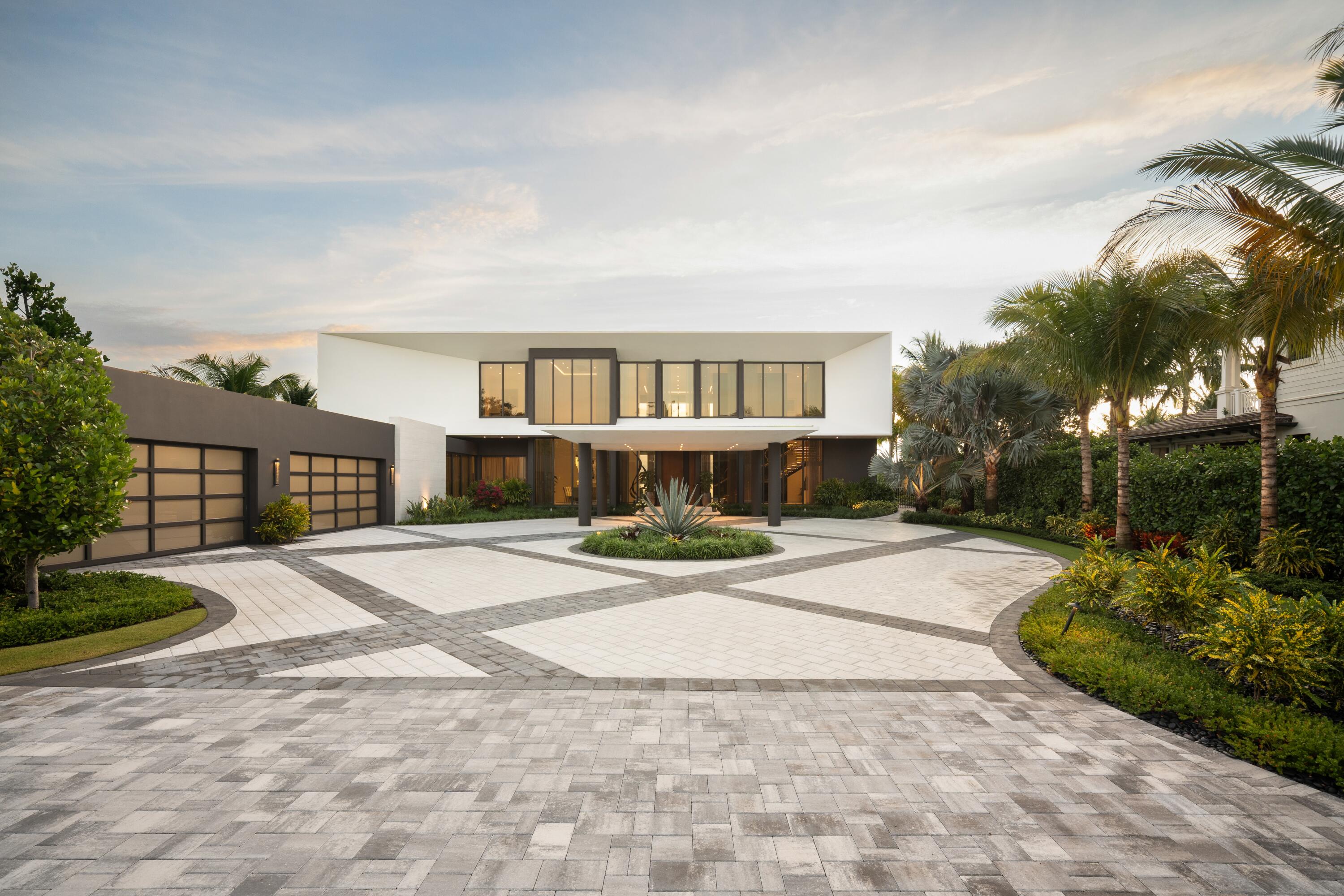 5211 Pennock Point Road Jupiter, FL 33458 - Photo 7 of 69 a front view of a house with yard and tress