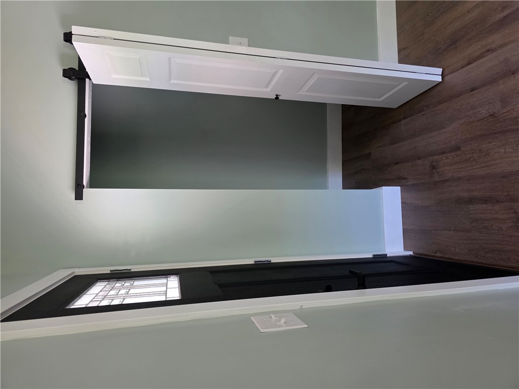 112 Simmons Street Anderson, SC 29625 - Photo 15 of 26 Seamlessly transition between spaces with this stylish barn door and elegant front entry.