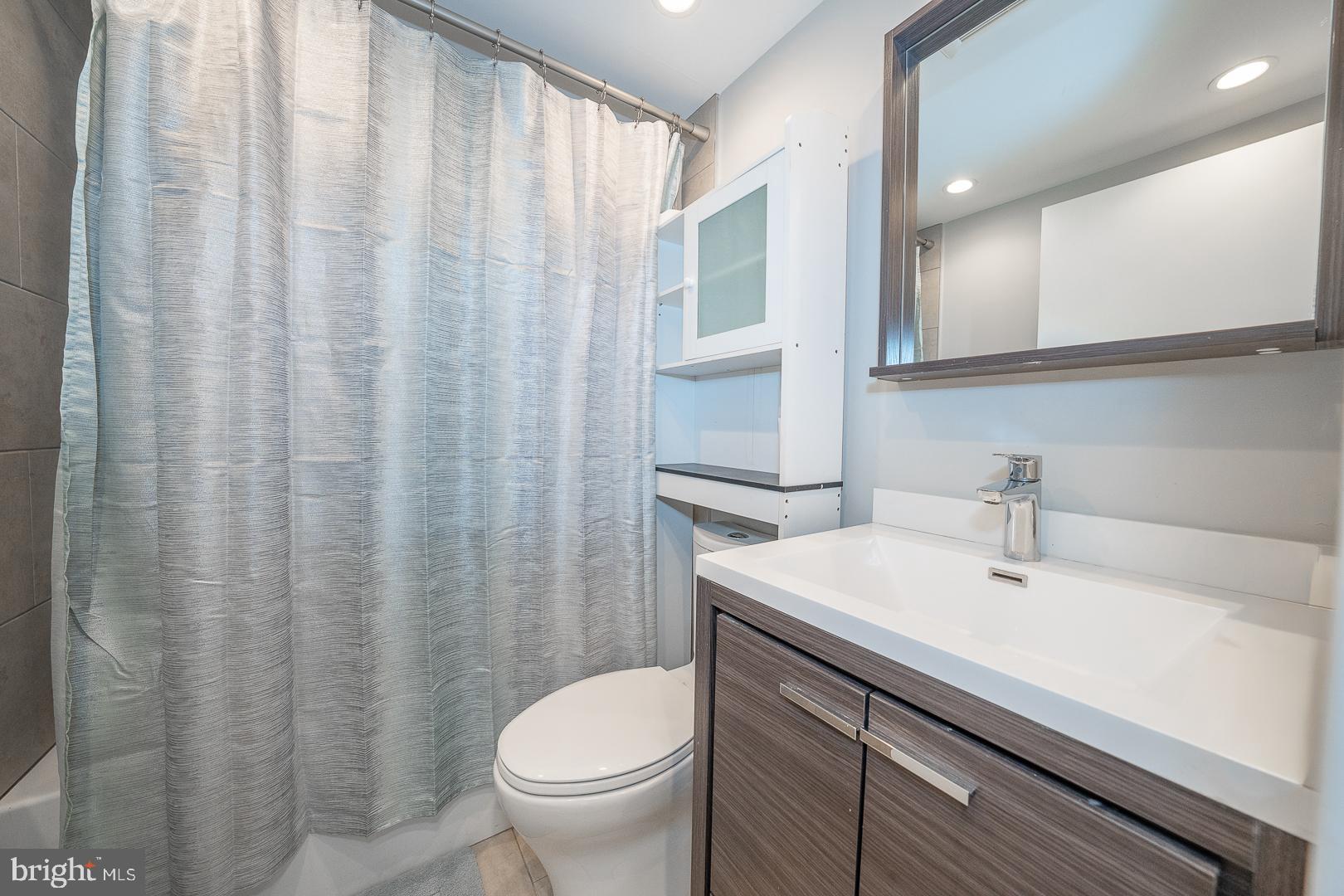 769 North Uber Street, Unit 2 Philadelphia, PA 19130 - Photo 12 of 23 a bathroom with a sink toilet and shower