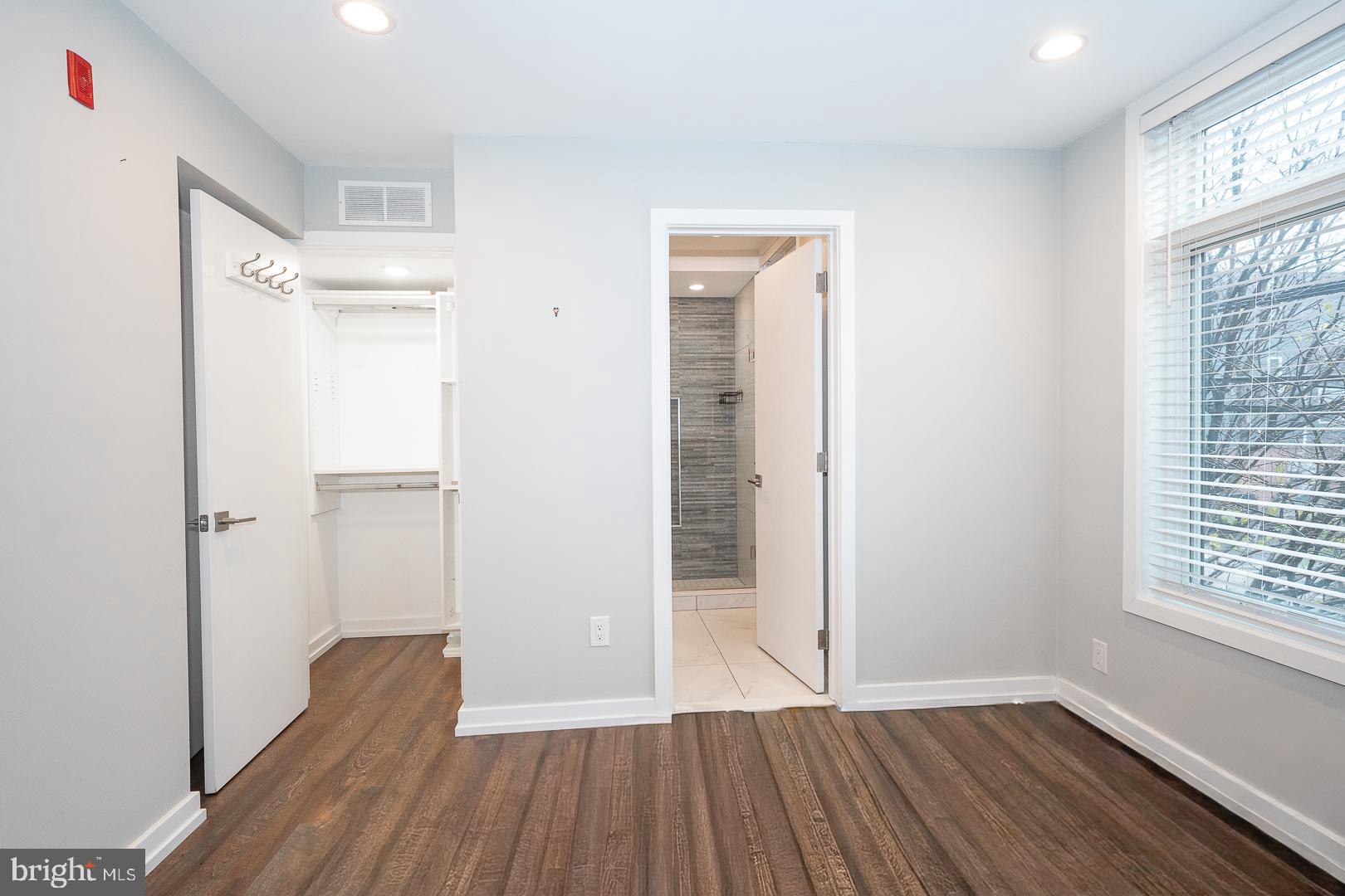 769 North Uber Street, Unit 2 Philadelphia, PA 19130 - Photo 18 of 23 a view of hallway with wooden floor and window