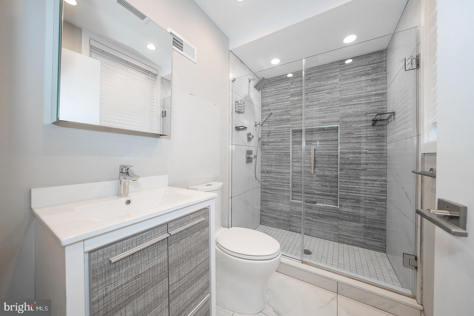 769 North Uber Street, Unit 2 Philadelphia, PA 19130 - Photo 19 of 23 a bathroom with a sink a toilet and shower