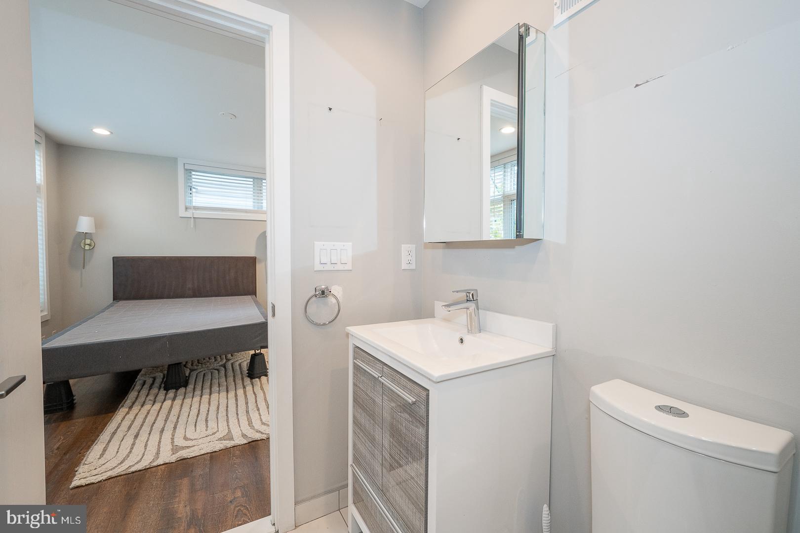 769 North Uber Street, Unit 2 Philadelphia, PA 19130 - Photo 20 of 23 a bathroom with a sink a toilet and a mirror