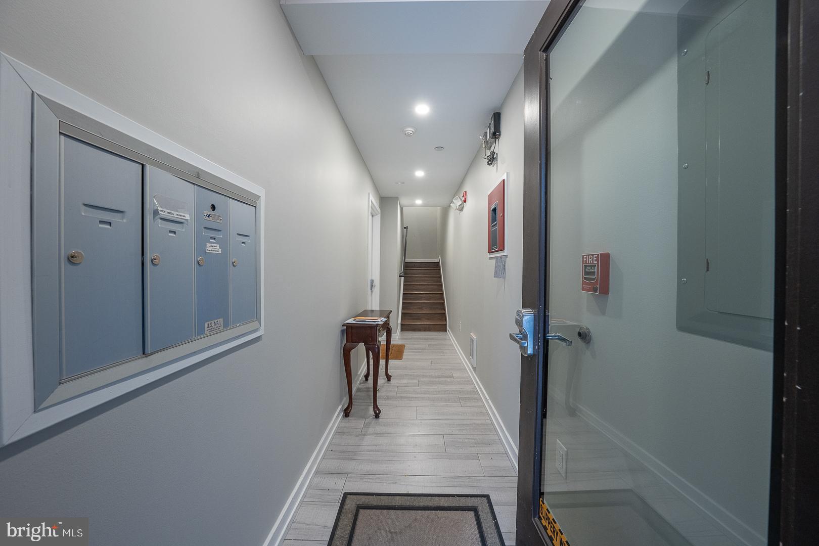 769 North Uber Street, Unit 2 Philadelphia, PA 19130 - Photo 21 of 23 a view of a hallway with wooden floor and staircase