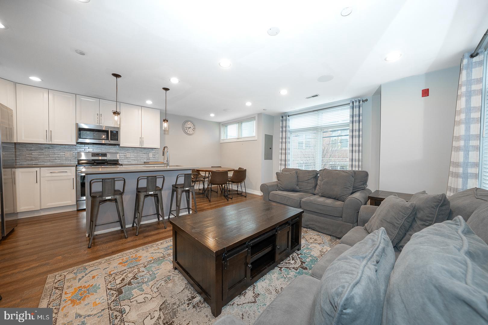 769 North Uber Street, Unit 2 Philadelphia, PA 19130 - Photo 4 of 23 a living room with stainless steel appliances furniture and a kitchen view