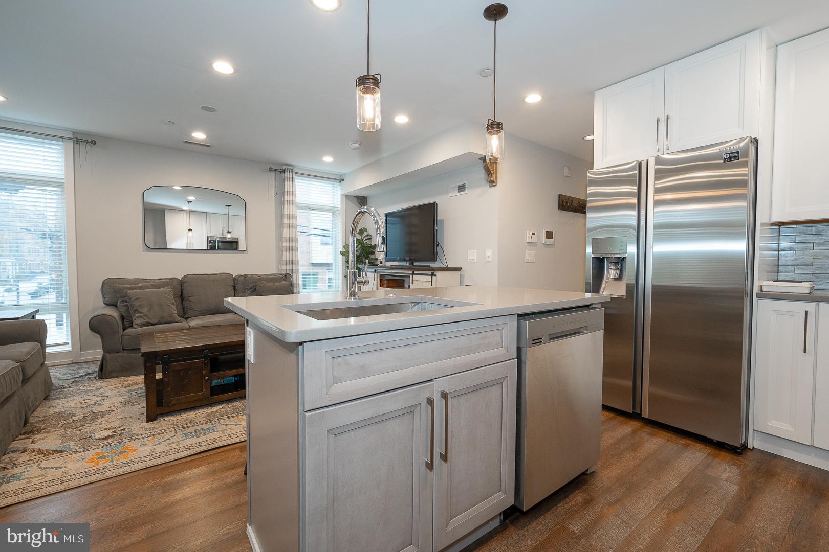 769 North Uber Street, Unit 2 Philadelphia, PA 19130 - Photo 8 of 23 a kitchen with cabinets and stainless steel appliances