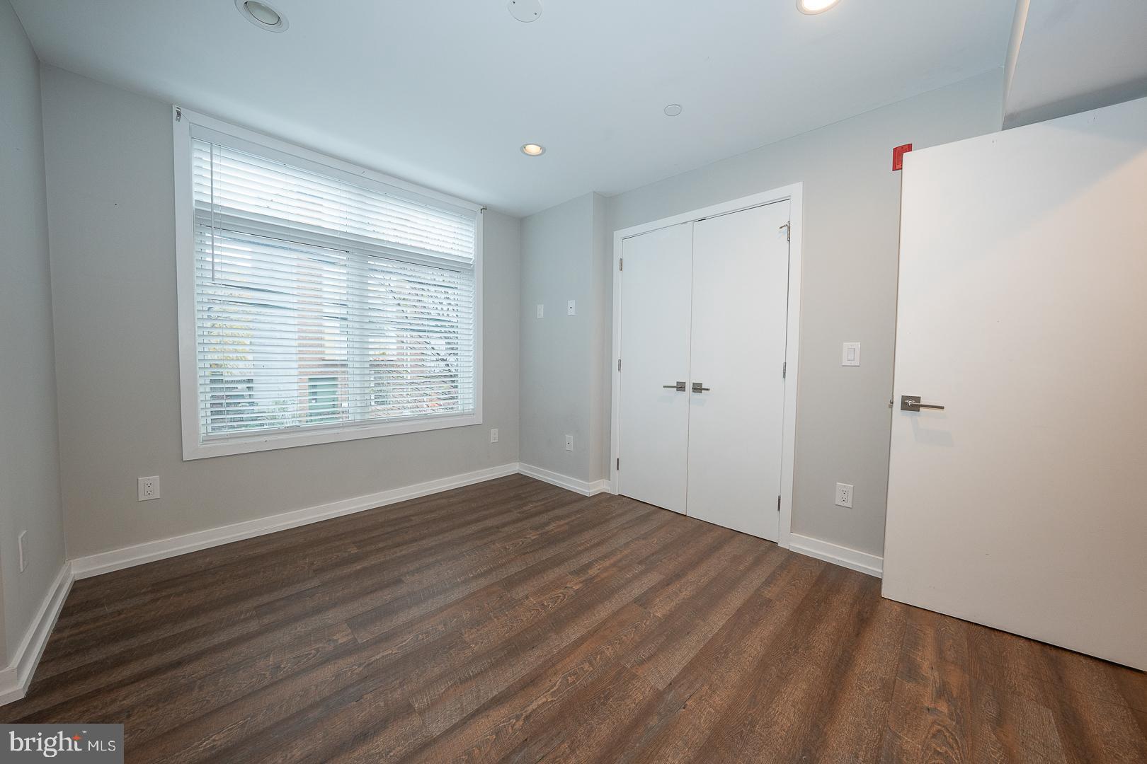 769 North Uber Street, Unit 2 Philadelphia, PA 19130 - Photo 10 of 23 a view of an empty room with wooden floor and a window