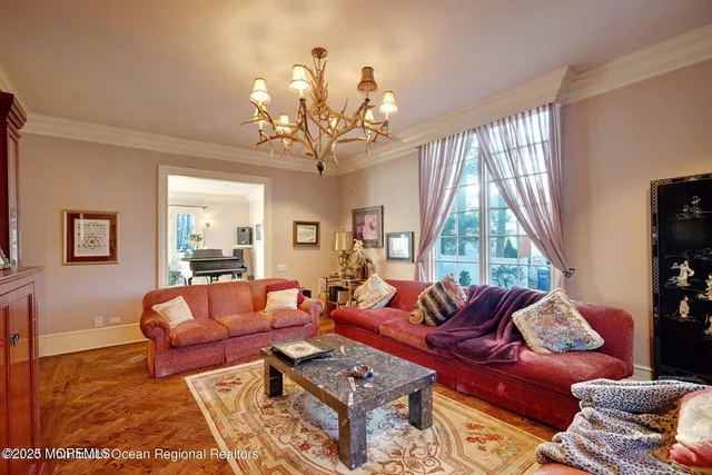 a view of a dining room with furniture wooden floor and chandelier