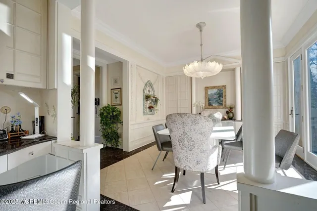 a bed room with a bed and a chandelier