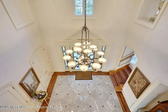 a bed room with a bed window and a television
