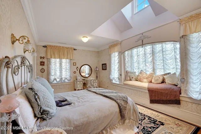 a bedroom with furniture and a flat screen tv