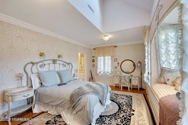 a bathroom with a double vanity sink a mirror and shower