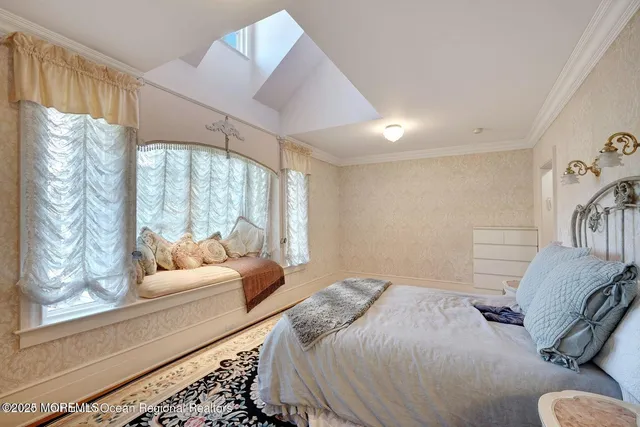 a bedroom with a bed and a desk