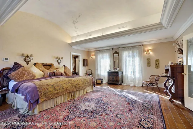 a bed room with a bed and a chandelier