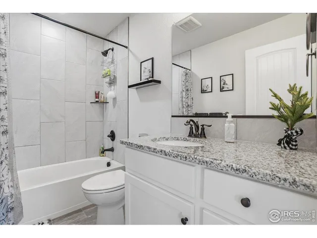 a view of bathroom with a tub and shower