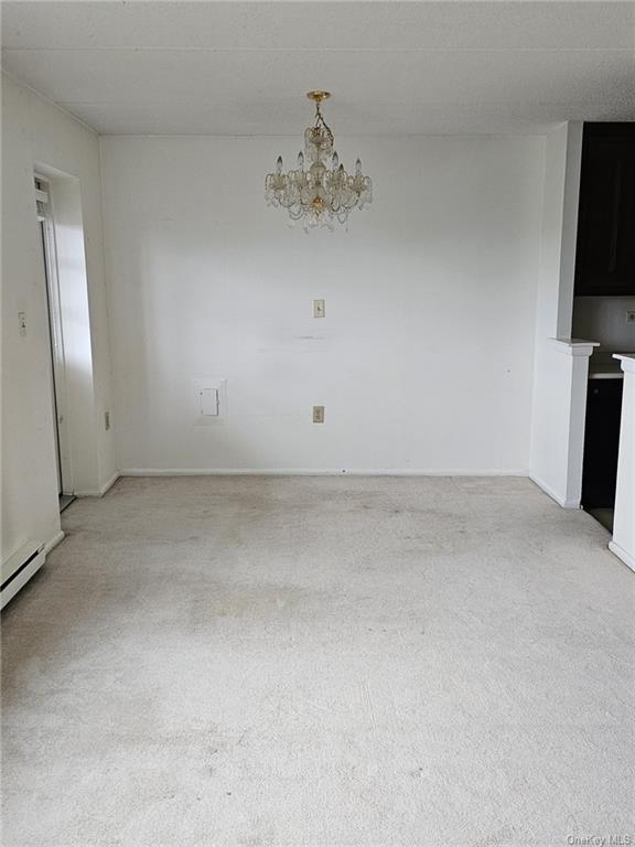 160 Academy Street, Unit 3N Poughkeepsie, NY 12601 - Photo 11 of 12 a view of an empty room with a fireplace