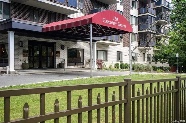 a view of a chair and table in the balcony