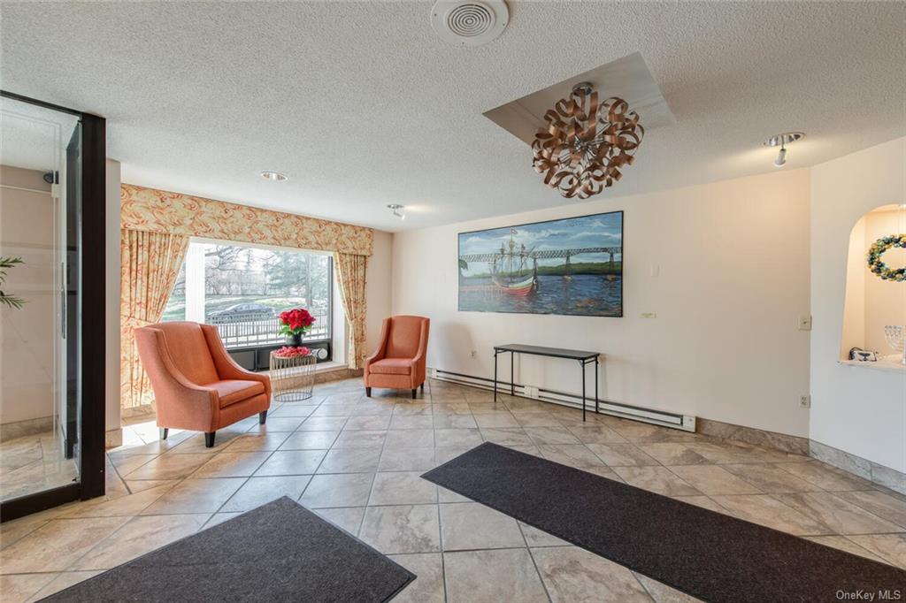 160 Academy Street, Unit 3N Poughkeepsie, NY 12601 - Photo 4 of 12 a outdoor living space with furniture and a flat screen tv