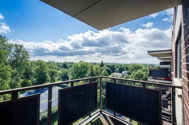 a view of a balcony with city view
