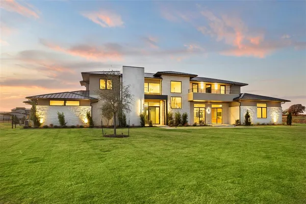 a big yard with large trees and a big yard