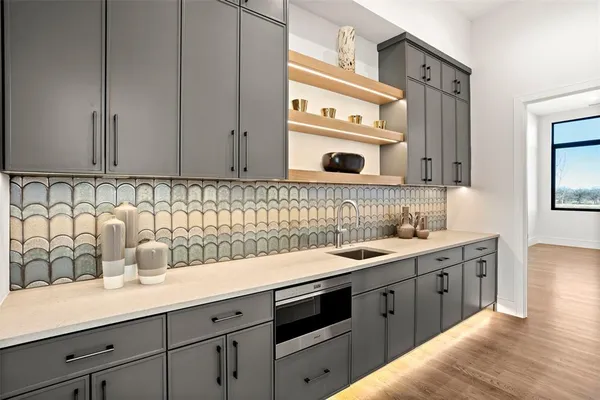 a kitchen with a sink and cabinets