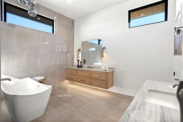 a bathroom with a bathtub and sink