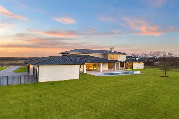 aerial view of a house with a big yard