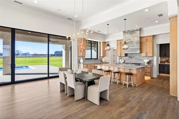 a kitchen with counter top space a sink appliances and cabinets