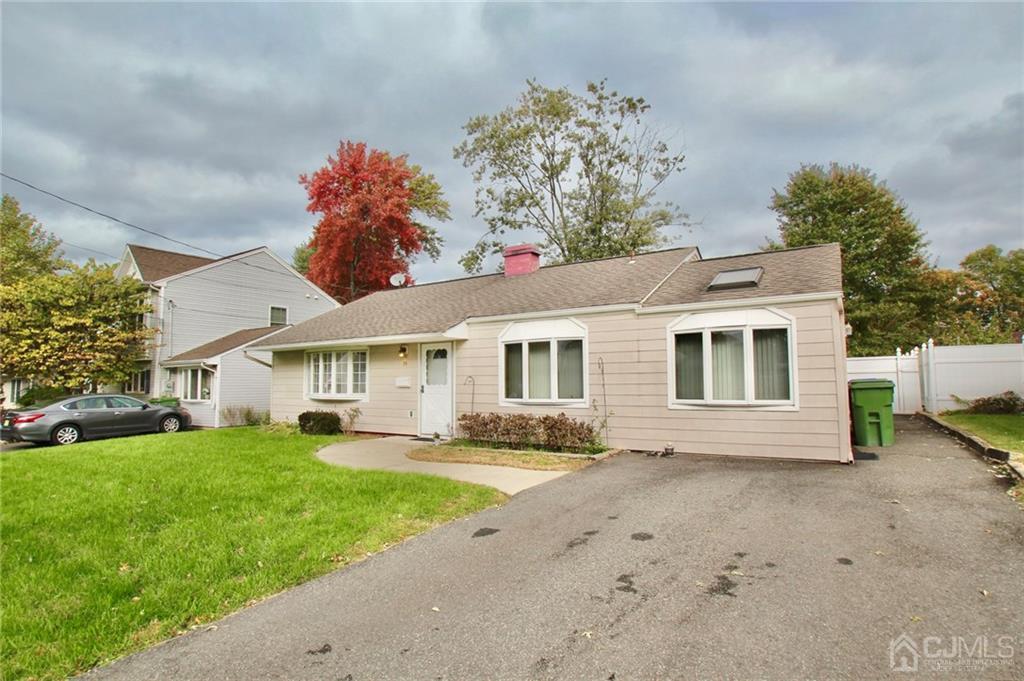19 Kenmore Road Edison, NJ 08817 - Photo 1 of 13 a front view of a house with a yard and garage