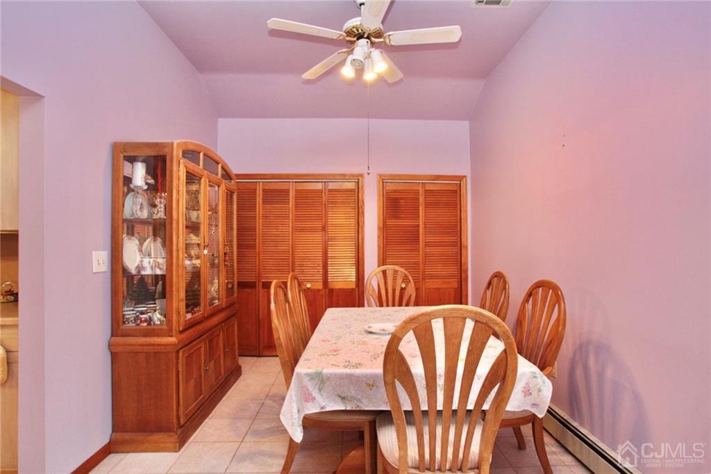 19 Kenmore Road Edison, NJ 08817 - Photo 11 of 13 a dining room with furniture and wooden floor
