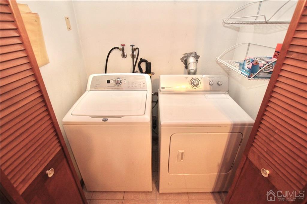 19 Kenmore Road Edison, NJ 08817 - Photo 12 of 13 a utility room with dryer and washer