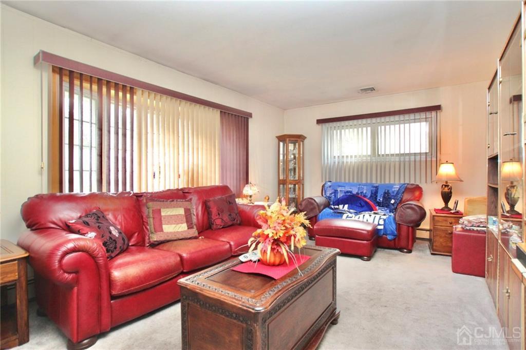 19 Kenmore Road Edison, NJ 08817 - Photo 3 of 13 a living room with furniture and a large window