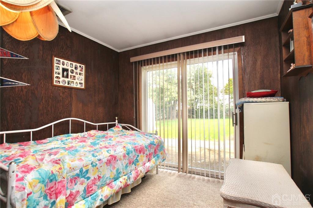 19 Kenmore Road Edison, NJ 08817 - Photo 6 of 13 a bedroom with a bed and a window