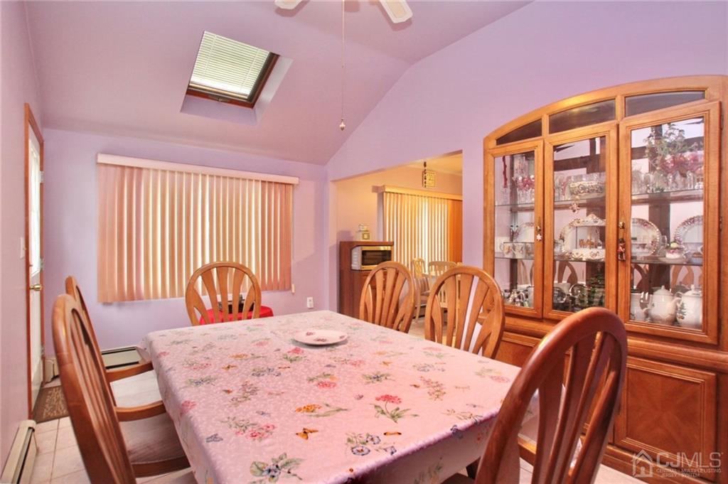 19 Kenmore Road Edison, NJ 08817 - Photo 10 of 13 a view of a dining room with furniture window and outside view