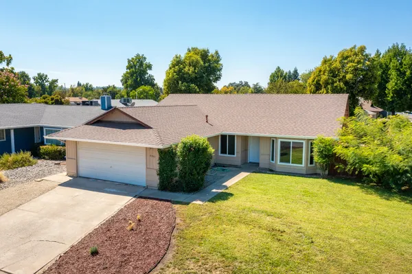 front view of a house with a yard