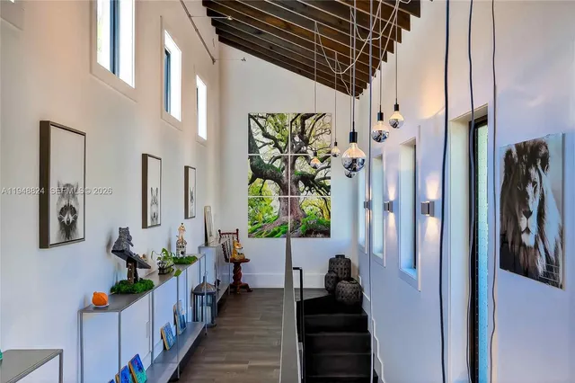 a living room with furniture ceiling fan and a window