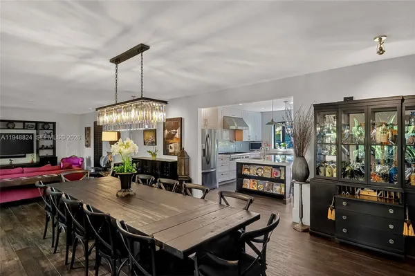a kitchen with white cabinets and a stove