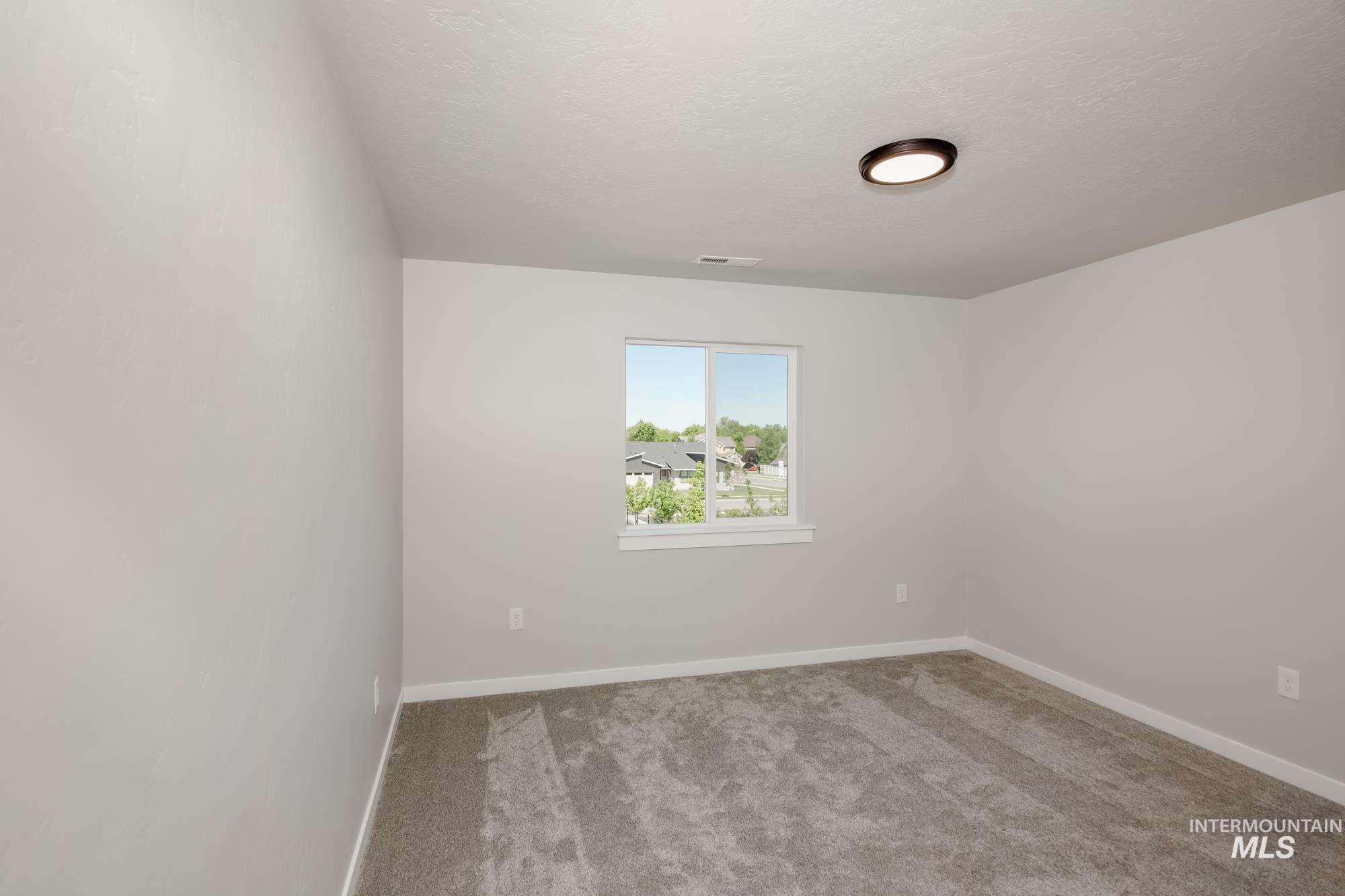 3039 South Alcamo Way Meridian, ID 83642 - Photo 19 of 20 Bright bedroom with space for a Small Desk and a Full size Bed.