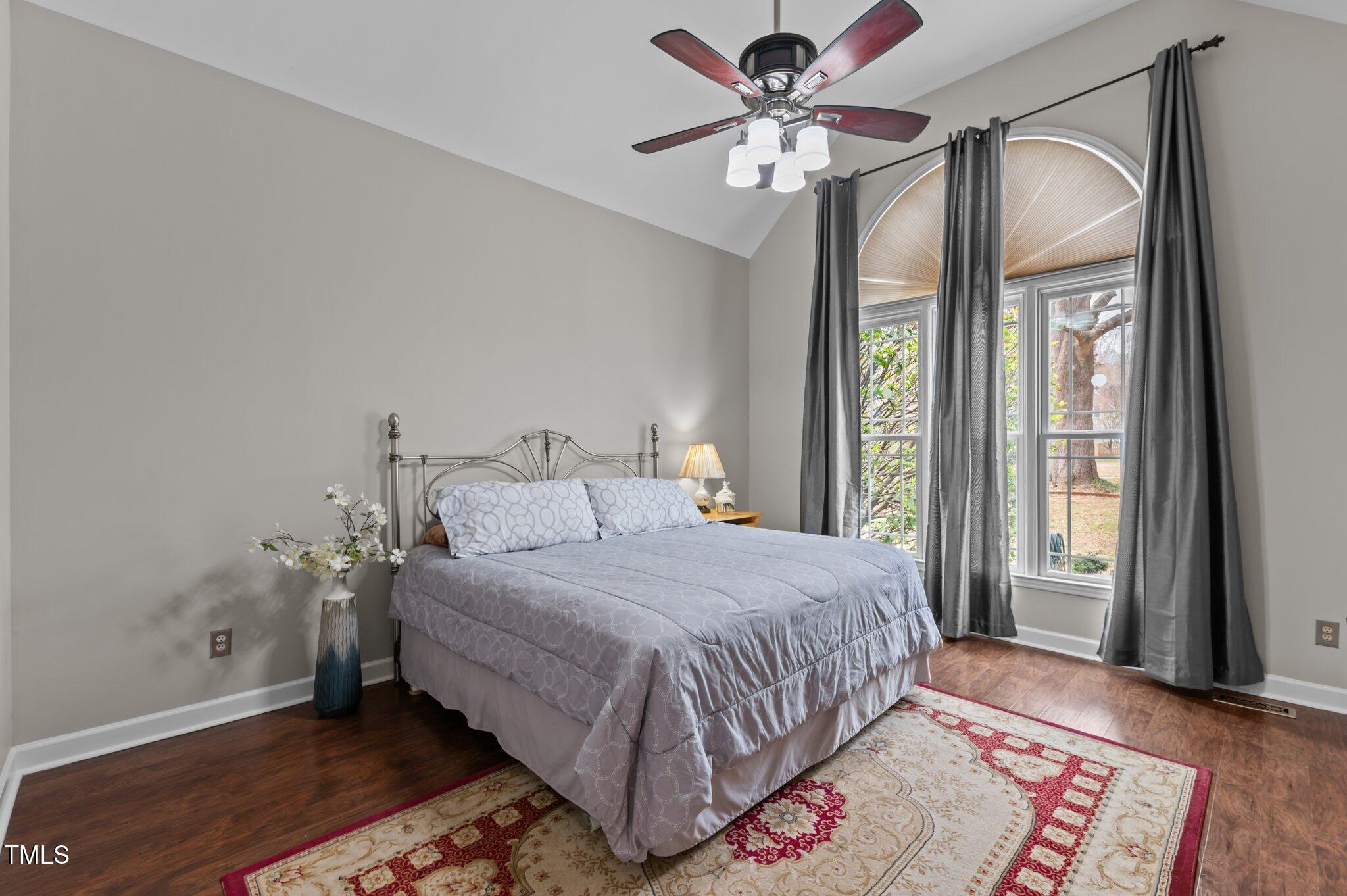 1217 Hillingdon Way Raleigh, NC 27614 - Photo 5 of 48 a bedroom with a bed chandelier and a window