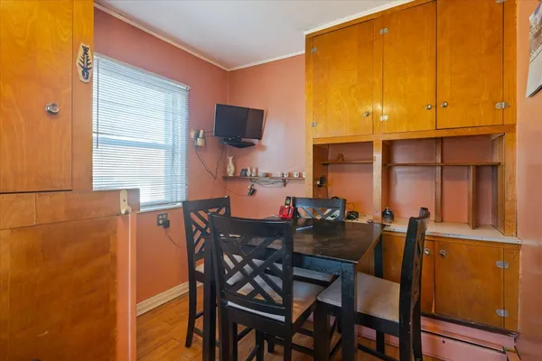 a dining room with furniture and window