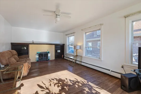a living room with furniture and a fireplace