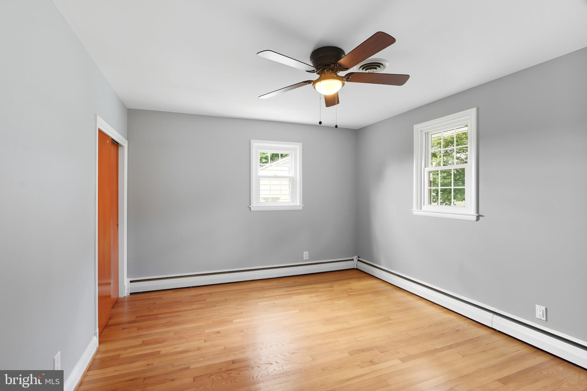 1910 Clifden Road Baltimore, MD 21228 - Photo 19 of 25 Bright and airy room with hardwood floors.