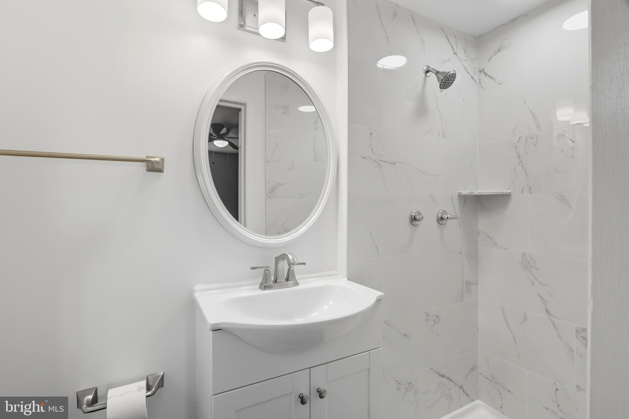 1910 Clifden Road Baltimore, MD 21228 - Photo 20 of 25 Sleek modern bathroom with elegant finishes.