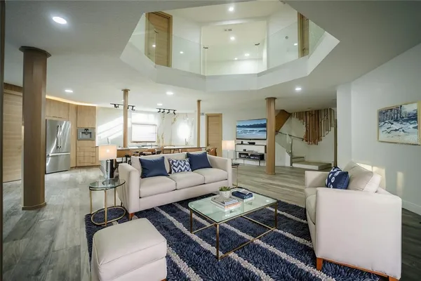 a living room with furniture and a table