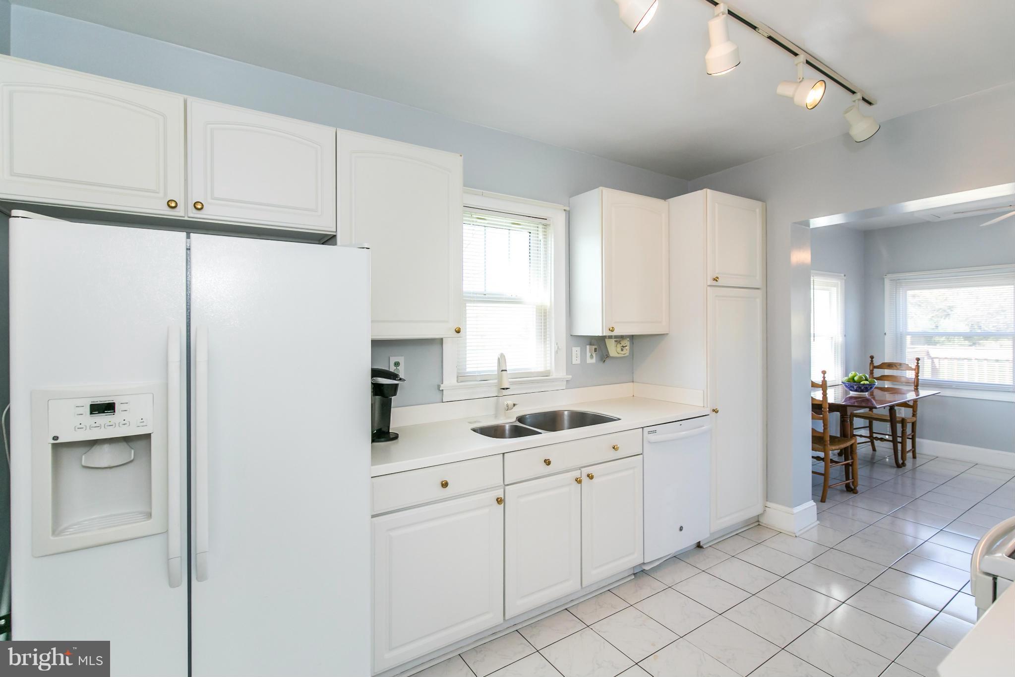 20935 Potomac View Road Sterling, VA 20165 - Photo 13 of 30 a kitchen with a sink cabinets and window