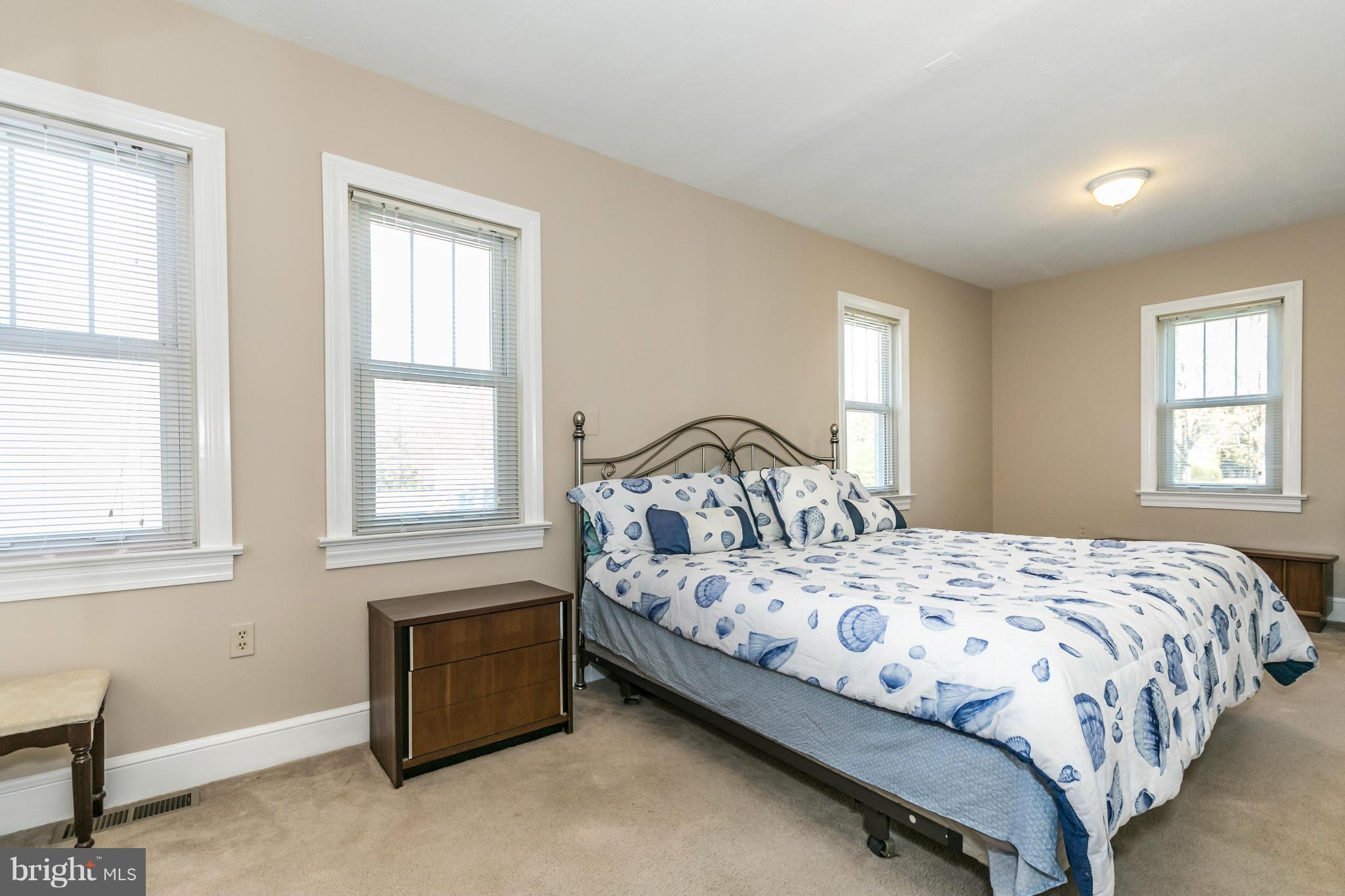 20935 Potomac View Road Sterling, VA 20165 - Photo 17 of 30 a bedroom with a bed and window