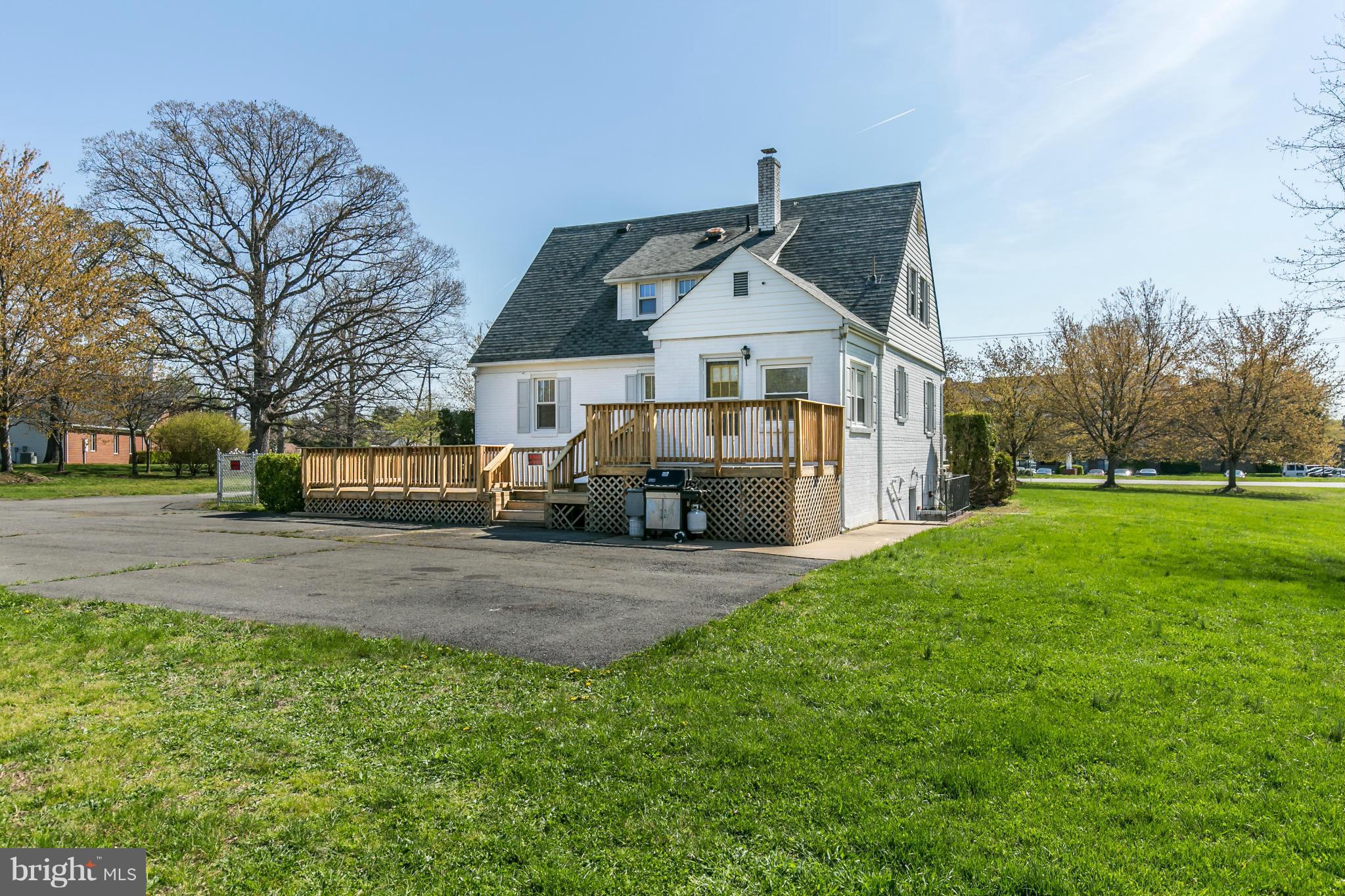 20935 Potomac View Road Sterling, VA 20165 - Photo 3 of 30 a front view of a house with a yard and trees