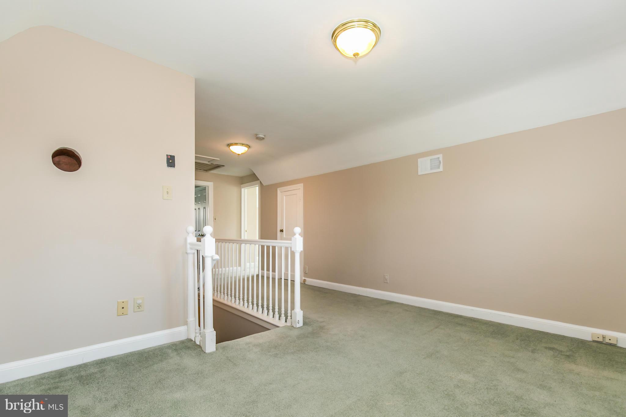 20935 Potomac View Road Sterling, VA 20165 - Photo 22 of 30 a view of a livingroom with a staircase