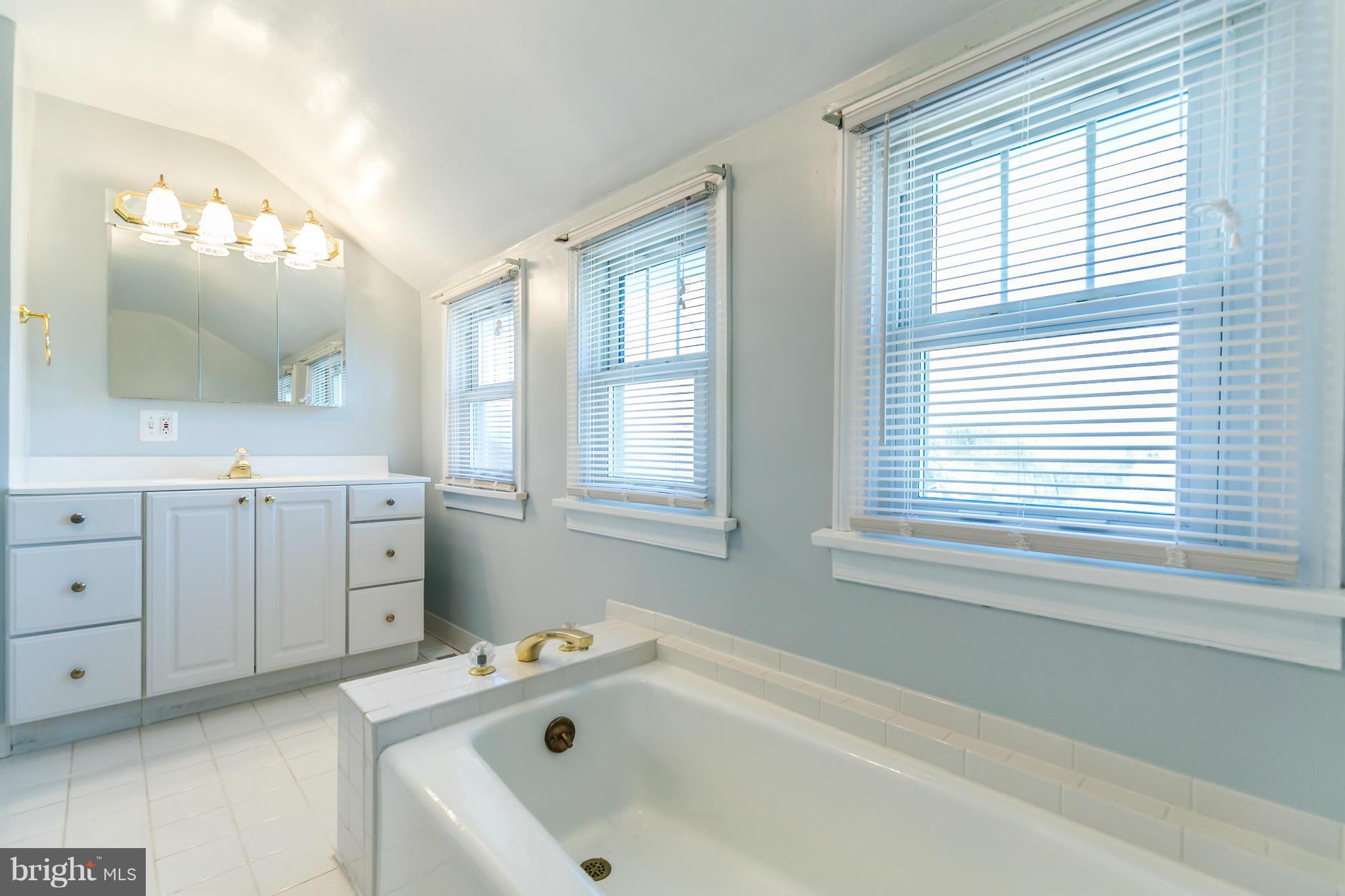 20935 Potomac View Road Sterling, VA 20165 - Photo 25 of 30 a bathroom with a tub sink and mirror