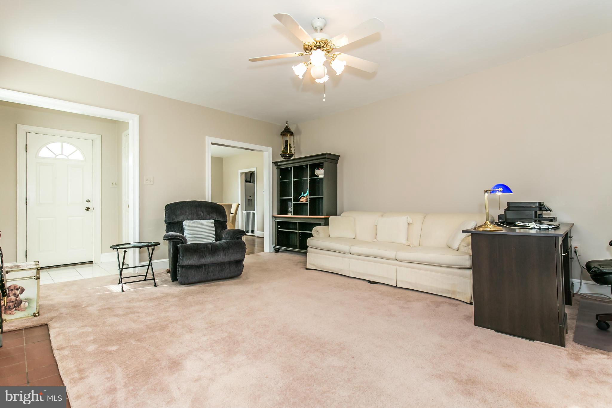 20935 Potomac View Road Sterling, VA 20165 - Photo 5 of 30 a living room with furniture and a chandelier