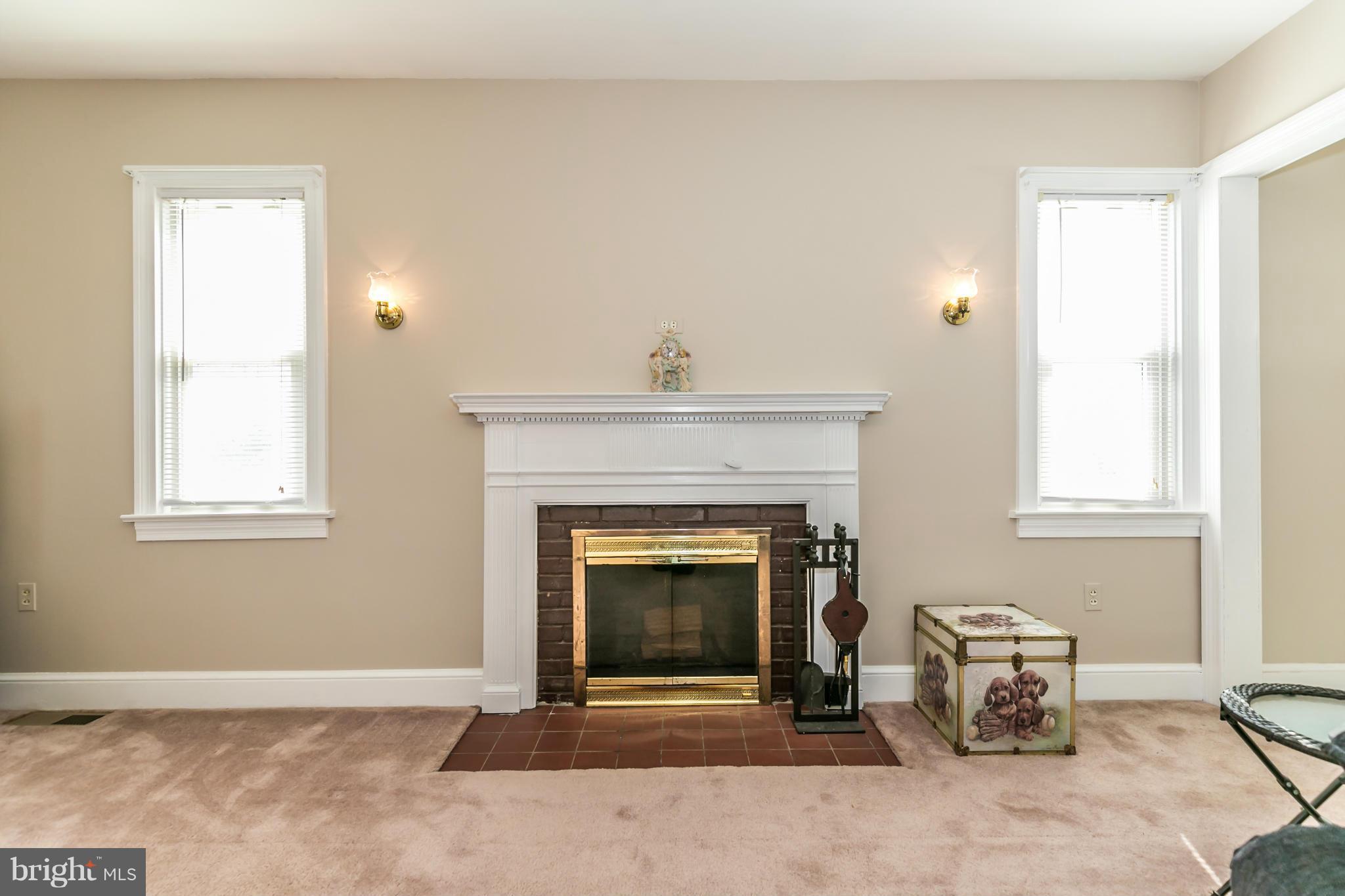 20935 Potomac View Road Sterling, VA 20165 - Photo 7 of 30 a living room with furniture and a fireplace